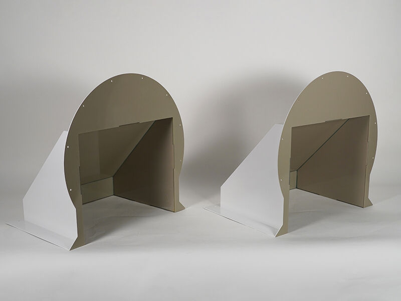 Radome environmental electrical cable covers - 2 per system. Image shows the structures at an angle. The interior is dark beige and exterior is painted white. They sit on a white background.