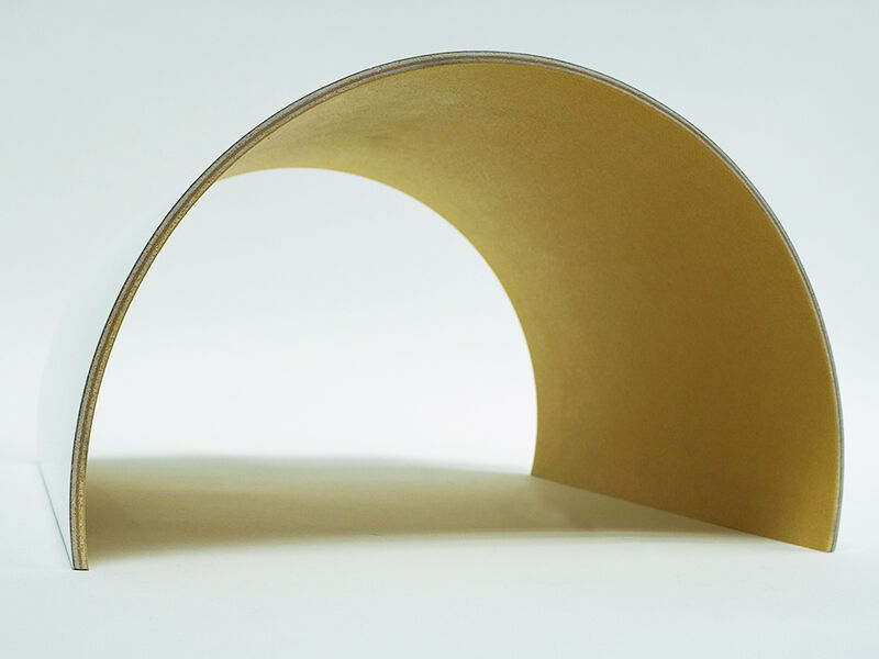 C-sandwich panel radome Image of C-sandwich curved panel radome from the front, sitting on a white surface. Interior of the curve is yellowish in color. Outside is painted white.