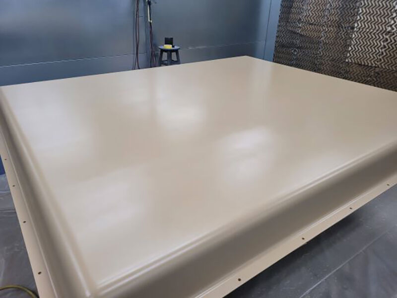 Large ground-based X-band radome for military end-use Large ground-based X-band radome for military end-use. Radome is in a paint booth with a freshly painted beige surface.