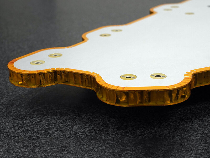 Spacecraft bus, shaped radiator panel detail (embedded heat pipes), corner detail Spacecraft bus, shaped radiator panel detail with  embedded heat pipes