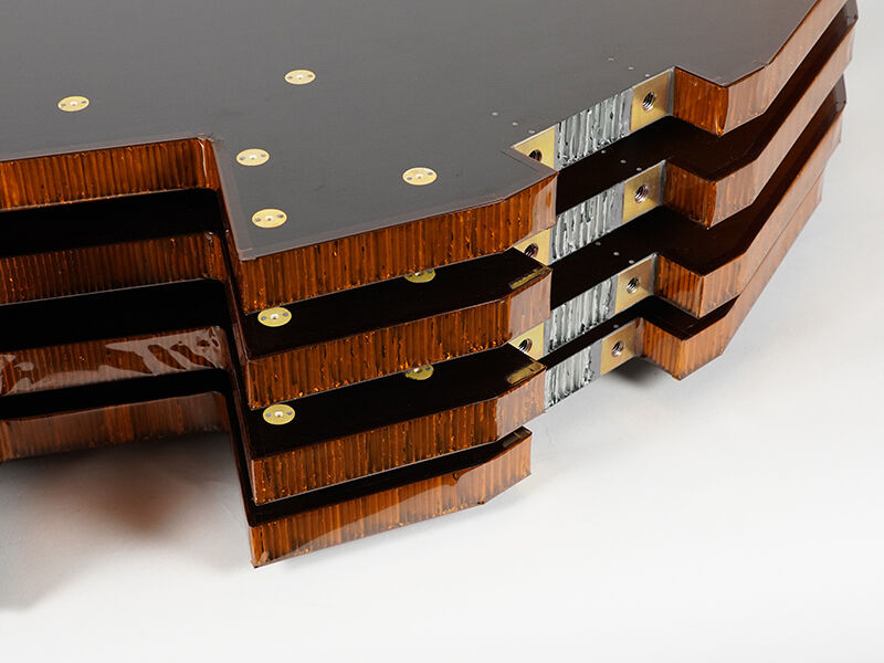 Edge details showing a stack of four DiskSat solar panels made of RWC's STRATOSubstrates™. Shows Kapton edging and metallic inserts 