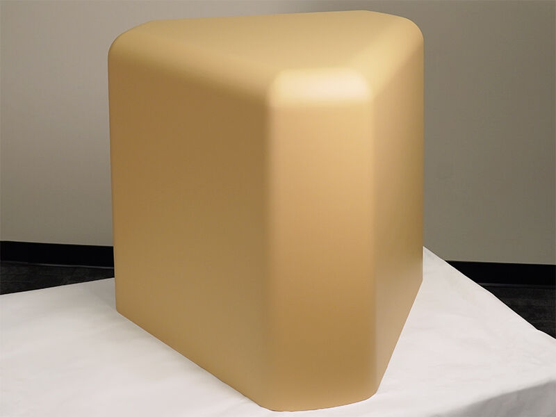 Low-cost ground radome for military-end use. Radome sits on a white surface. 